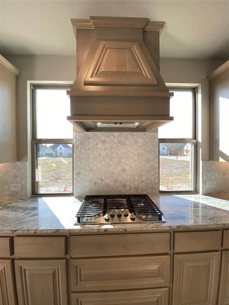 Built-in 5 burner GAS cooktop & custom cabinet vent hood to outside with pot & pan drawers and undercabinet lights Built-in 5 burner GAS cooktop & custom cabinet vent hood to outside with pot & pan drawers and undercabinet lights