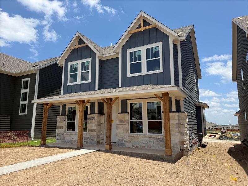 Front exterior of a new home in Lariat, Liberty Hill, TX, highlighting curb appeal (Image 8). Front exterior of a new home in Lariat, Liberty Hill, TX, highlighting curb appeal (Image 8).