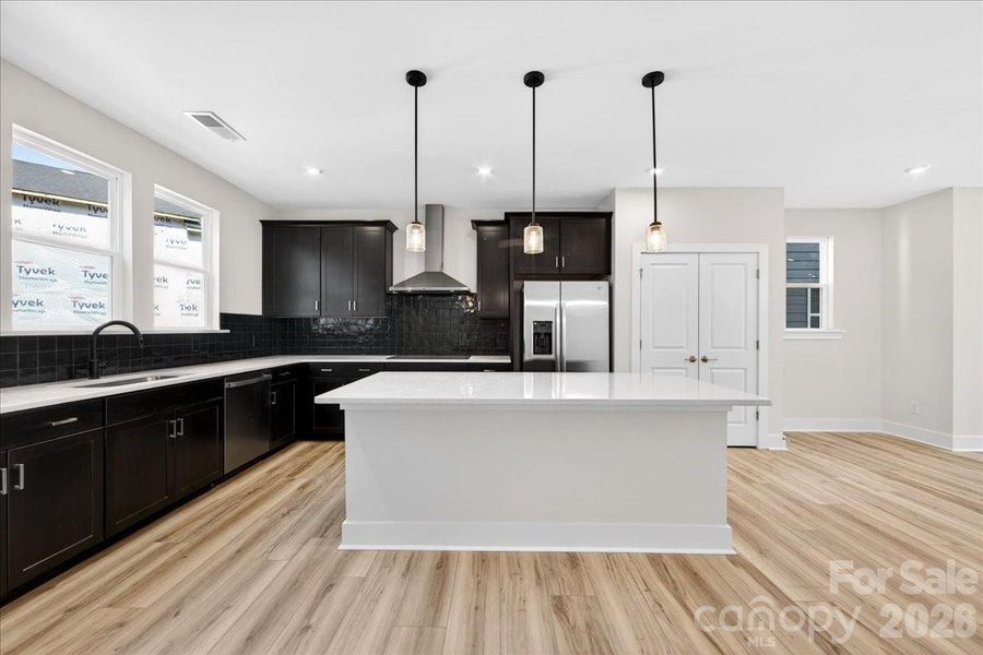 Light filled gourmet kitchen with large island