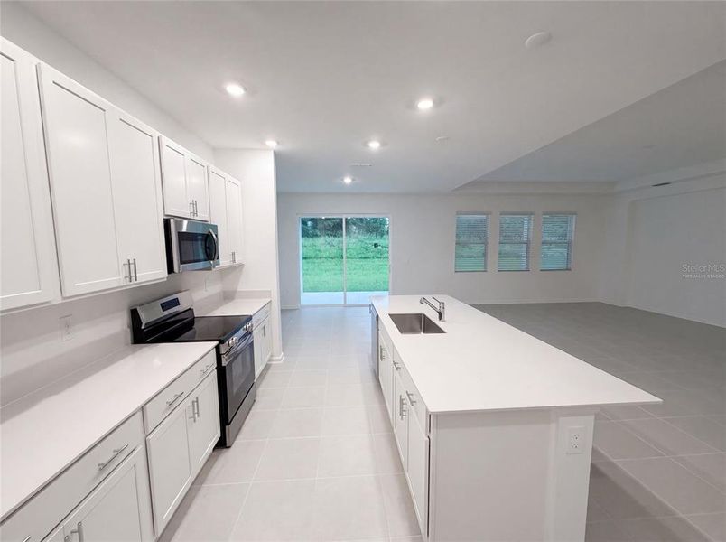Furnished interior view inside a new home in Meadow Pointe, Groveland (Image 6).