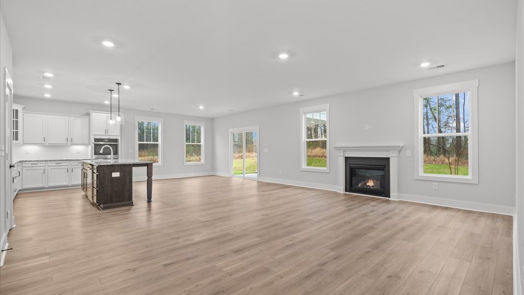 Hardwood flooring and high standards define this vibrant family room ideal for everyday living