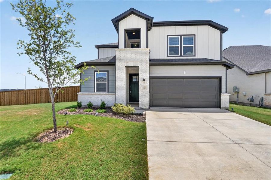 Front exterior of a new home in Madero 50s, Fort Worth, TX, highlighting curb appeal (Image 1). Front exterior of a new home in Madero 50s, Fort Worth, TX, highlighting curb appeal (Image 1).