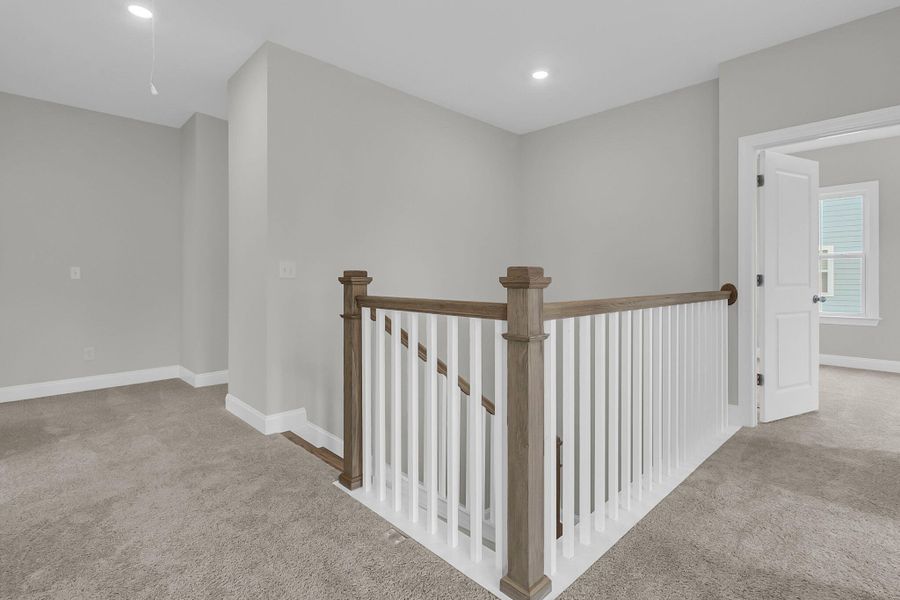 Spacious, unfurnished interior of a new home in Tidewater at Lakes of Cane Bay, Summerville (Image 31).