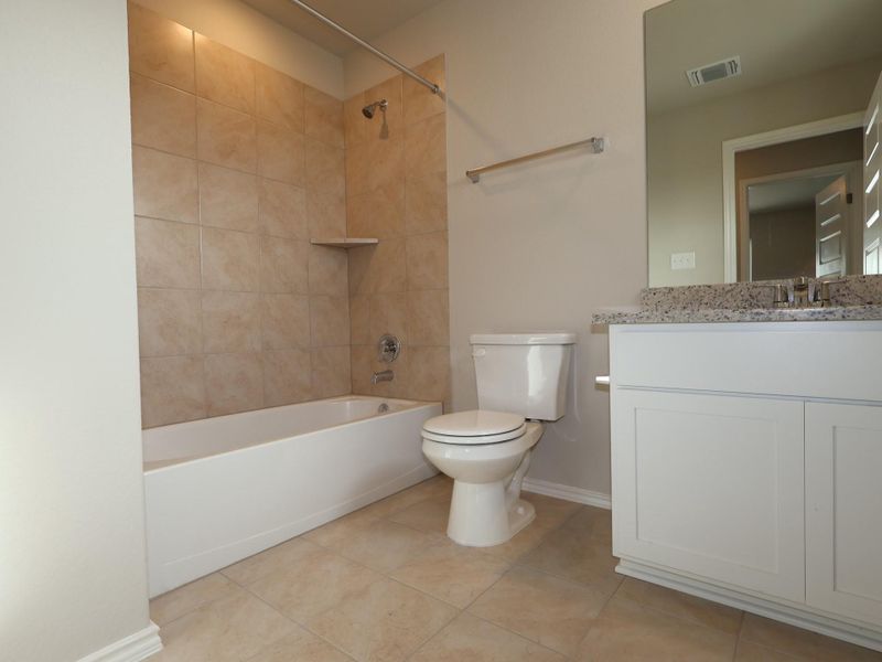 Furnished interior view inside a new home in Heritage, Dripping Springs (Image 7).