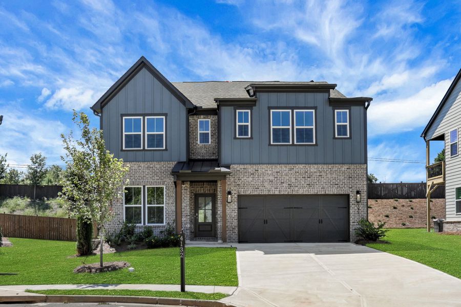 Front exterior of a new home in The Paddocks at Doc Hughes, Buford, GA, highlighting curb appeal (Image 1). Front exterior of a new home in The Paddocks at Doc Hughes, Buford, GA, highlighting curb appeal (Image 1).