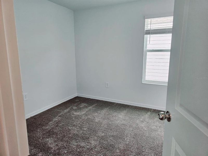 Spacious, unfurnished interior of a new home in Peace Creek Reserve, Winter Haven (Image 10).