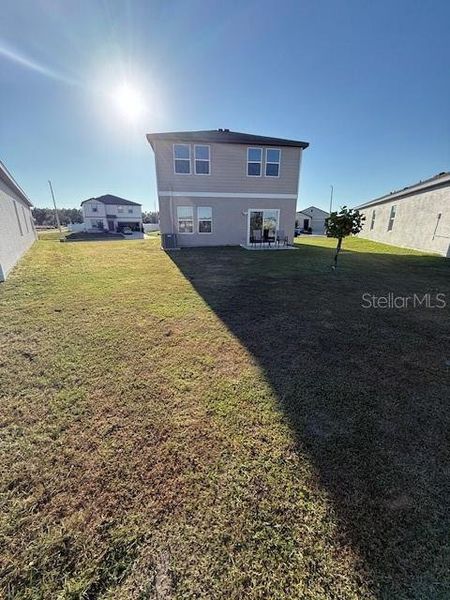 Exterior details and patio area of a home in Hidden Creek, Zephyrhills (Image 3).