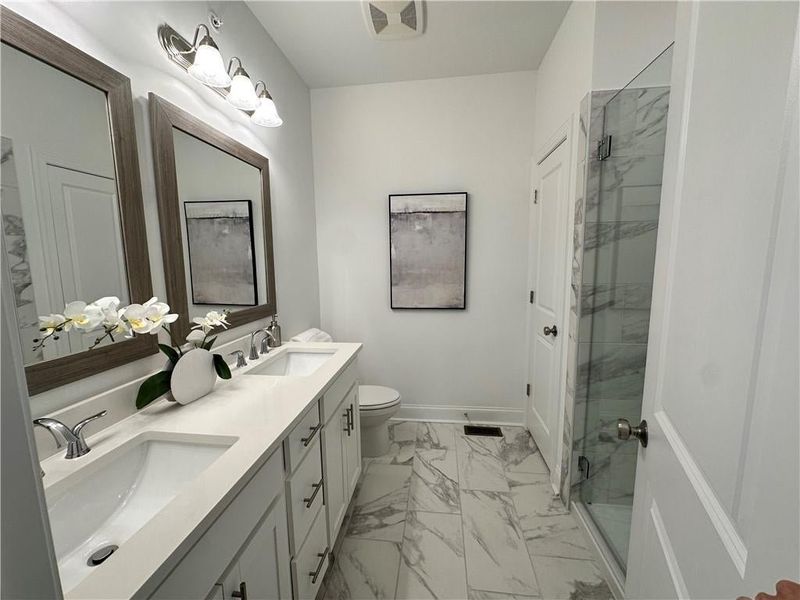 Owners Bathroom with upgraded 12x24 floor and shower wall tiles *photos are from the Magnolia model at different home site*