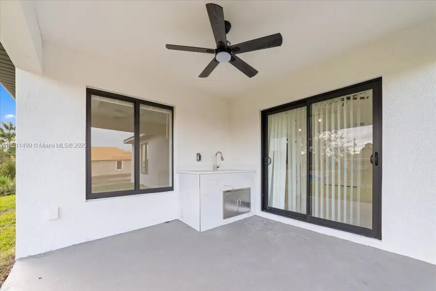 Exterior details and patio area of a home in , Lehigh Acres (Image 1).