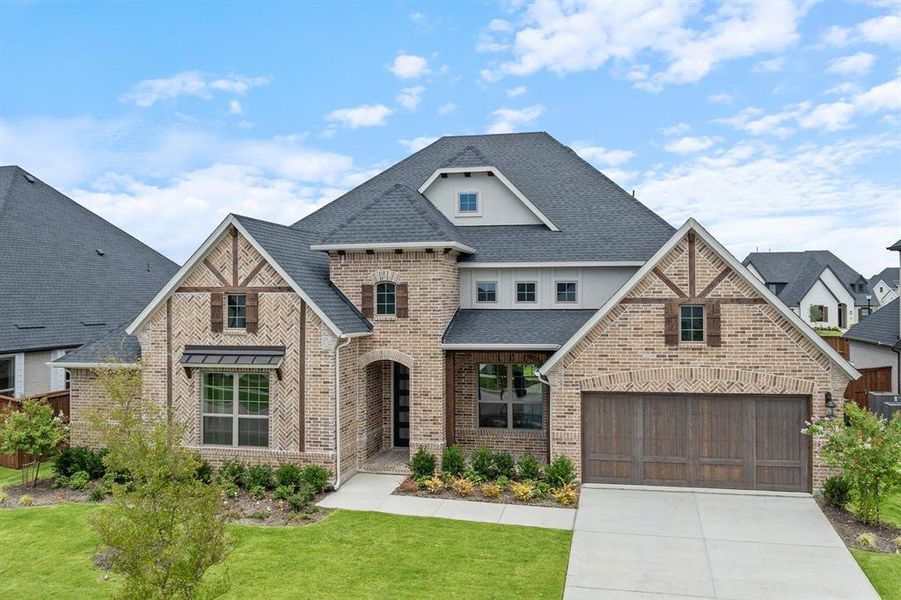 Front exterior of a new home in Windsong Ranch, Prosper, TX, highlighting curb appeal (Image 20). Front exterior of a new home in Windsong Ranch, Prosper, TX, highlighting curb appeal (Image 20).