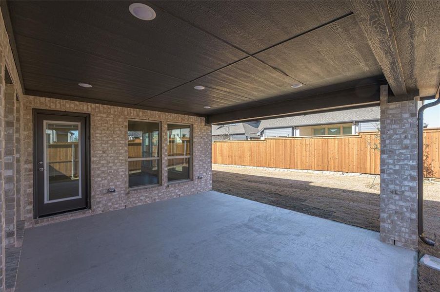 Exterior details and patio area of a home in Creekview Meadows, Pilot Point (Image 24).