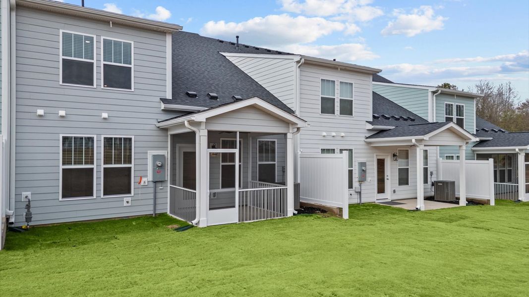 Elegant exterior with a rear screened porch perfect for relaxing or entertaining outdoors
