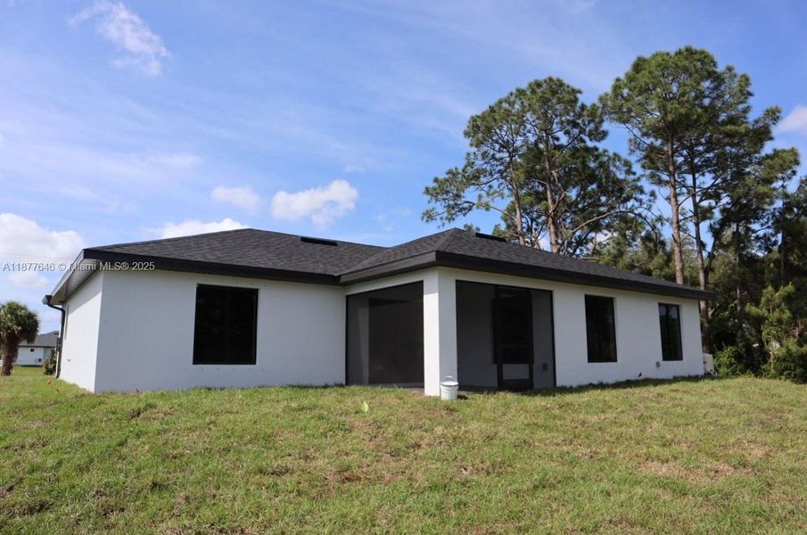 Front exterior of a new home in , Lehigh Acres, FL, highlighting curb appeal (Image 10).