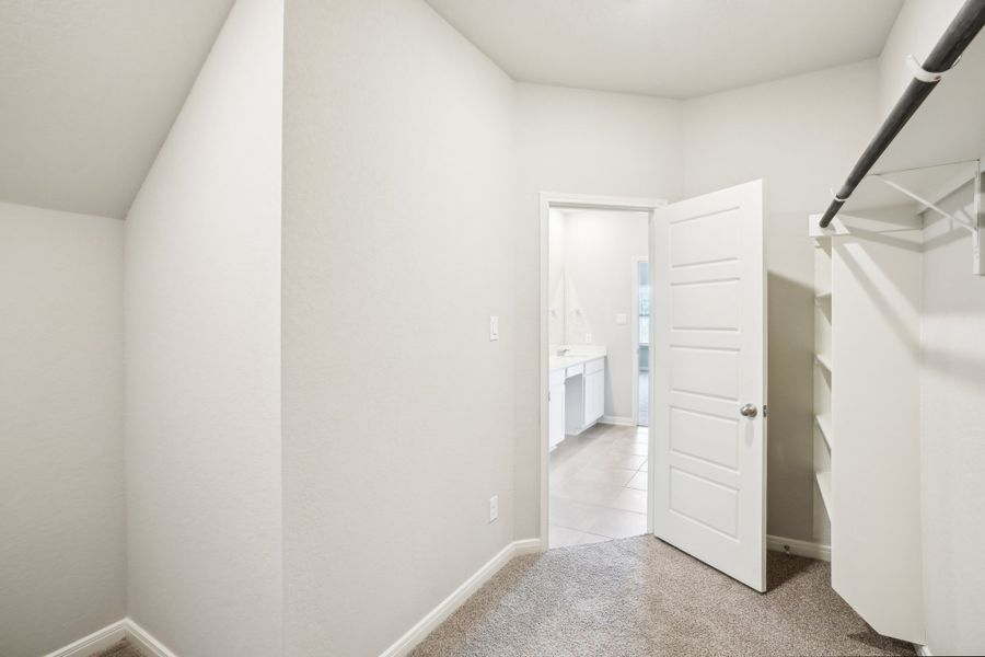 Primary suite walk-in closet of the Reynolds floorplan at a Meritage Homes community.