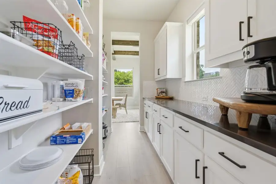 The Sizable Walk-In Pantry Is Also In This Area.