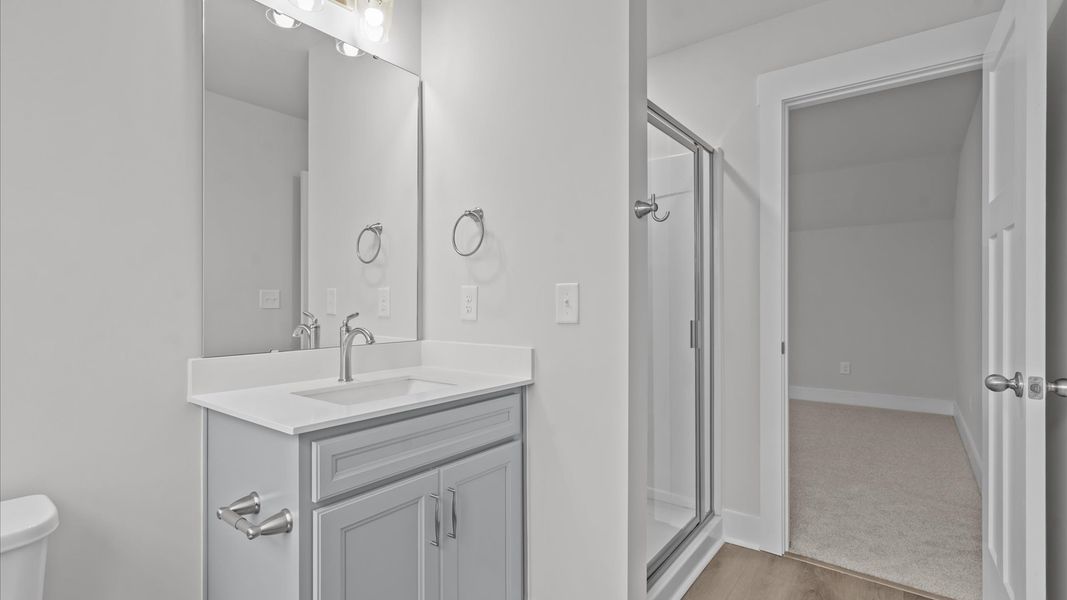 Refined hall bath with elevated finishes and a highly functional layout