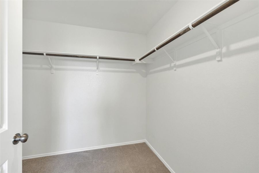 A well-organized closet offers ample storage with convenient hanging rods and shelving.