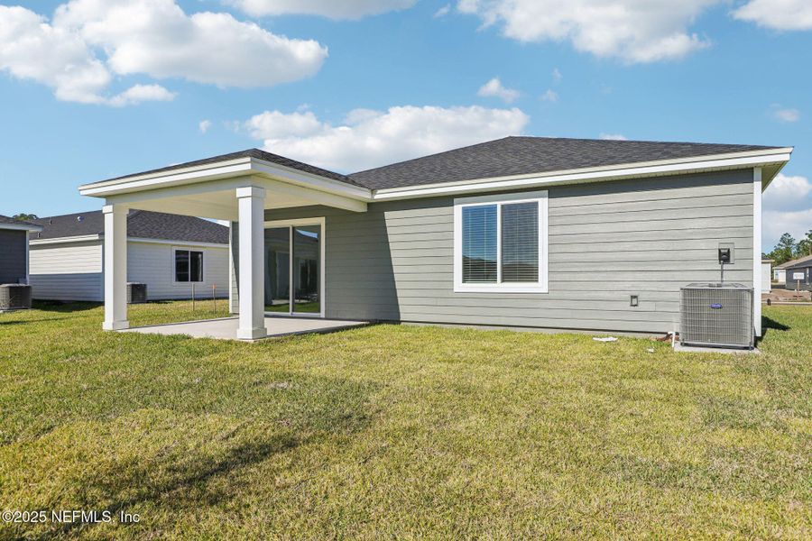 Exterior details and patio area of a home in Cypress Meadows - Signature Series, Jacksonville (Image 3).