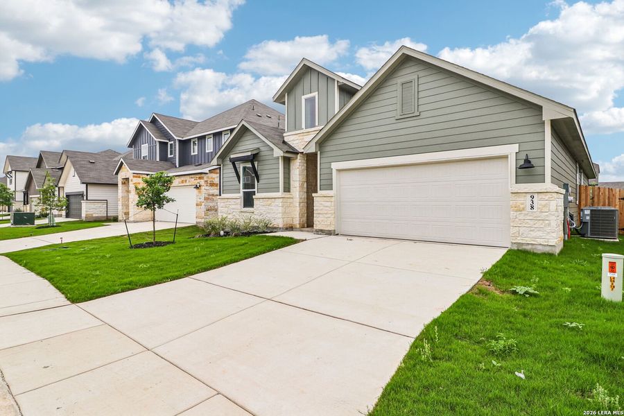 Front exterior of a new home in Estancia Ranch - Classic Series, San Antonio, TX, highlighting curb appeal (Image 27).
