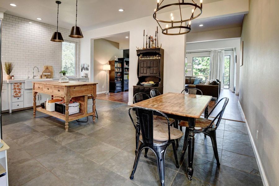 Dining room featuring recessed lighting and a chandelier Dining room featuring recessed lighting and a chandelier