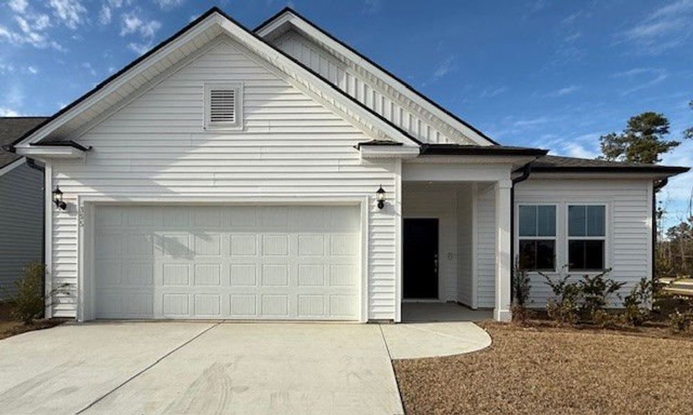 Front exterior of a new home in Crescent Cove, Myrtle Beach, SC, highlighting curb appeal (Image 14).