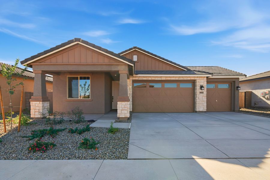 Front exterior of a new home in Marbella at Windrose, Waddell, AZ, highlighting curb appeal (Image 1). Front exterior of a new home in Marbella at Windrose, Waddell, AZ, highlighting curb appeal (Image 1).