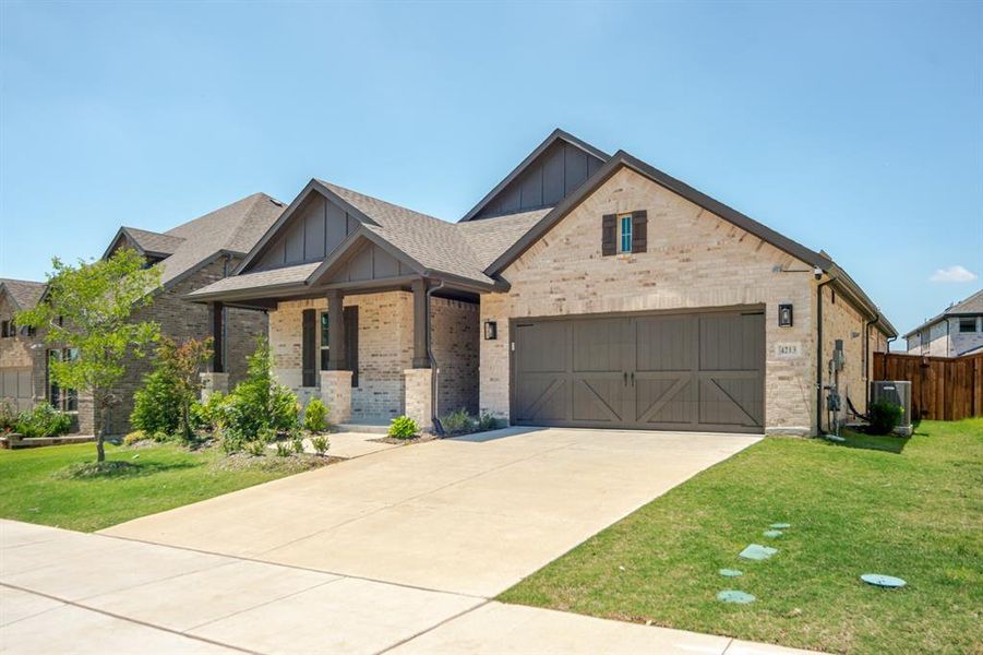 Stone and brick exterior with a dark-toned gable roof