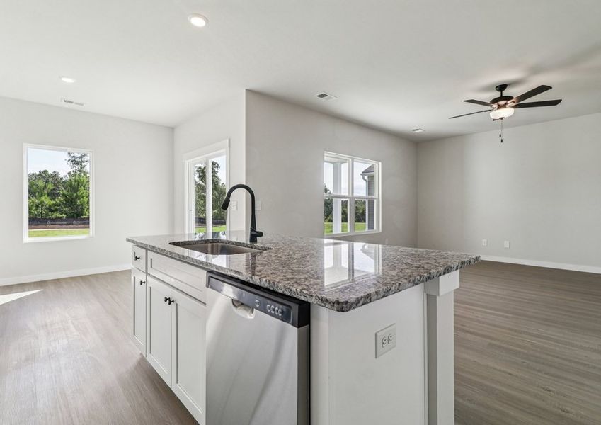 The kitchen has a granite island.