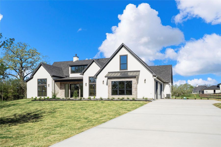 Front exterior of a new home in , Bryan, TX, highlighting curb appeal (Image 1). Front exterior of a new home in , Bryan, TX, highlighting curb appeal (Image 1).