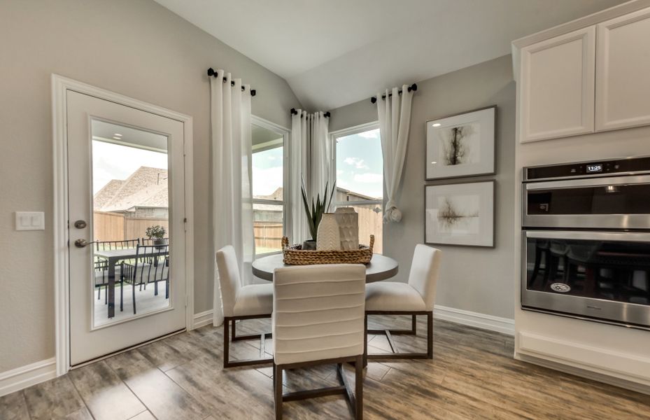 Breakfast nook off kitchen with access to covered