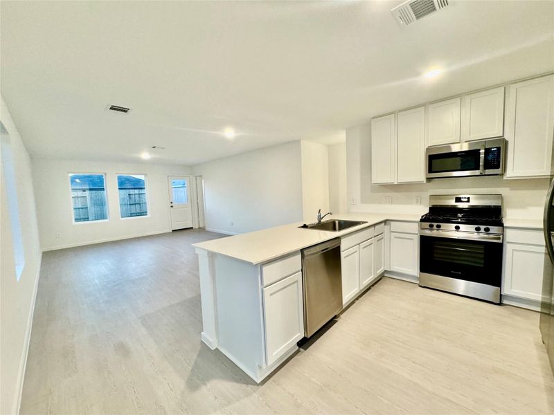 Furnished interior view inside a new home in Pinewood at Grand Texas, New Caney (Image 5).