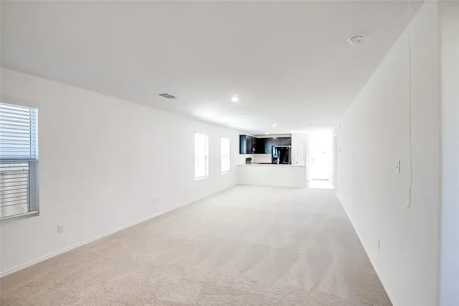 Spacious, unfurnished interior of a new home in Bastrop Grove: Stonehill Collection, Bastrop (Image 10).
