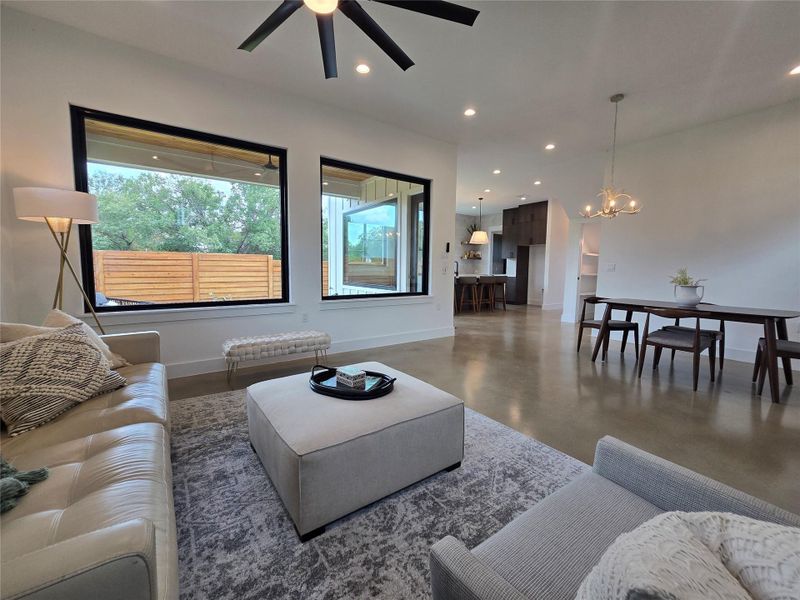 Set up the living space as you wish - lots of space for dining, living, or play areas. Lots of windows throughout, uppers for light and privacy from neighbors, and huge windows to your back yard.