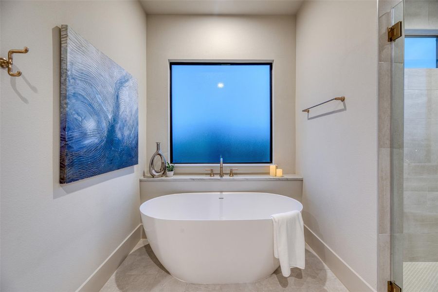 Relax in the primary ensuite bath Relax in the primary ensuite bath