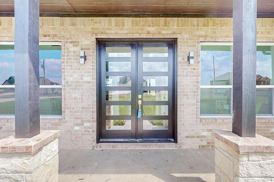 View of exterior entry featuring french doors