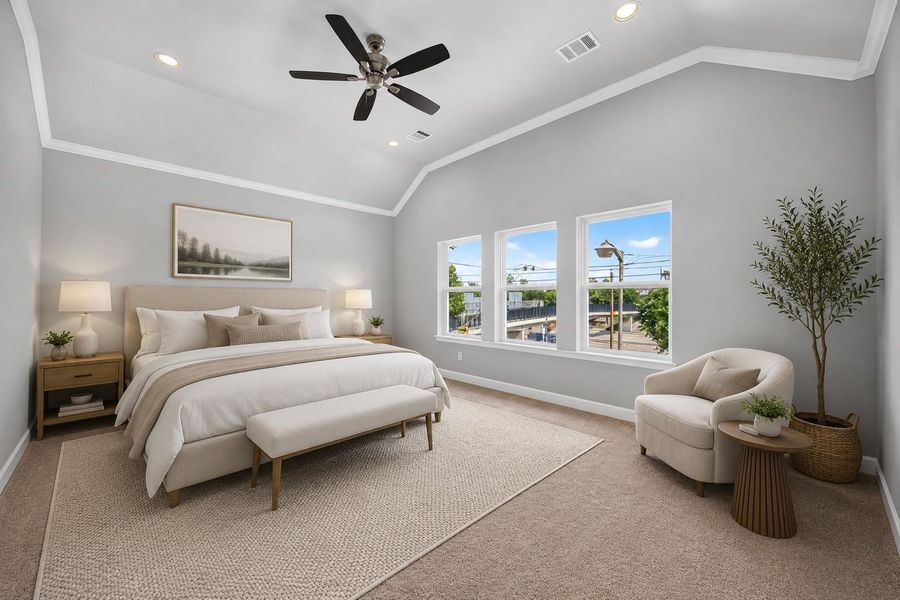 Primary Bedroom Escape – Vaulted ceilings, oversized windows, and just enough room for a cozy reading nook make this suite the one you'll retreat to at the end of the day. *Image Virtually Staged.*