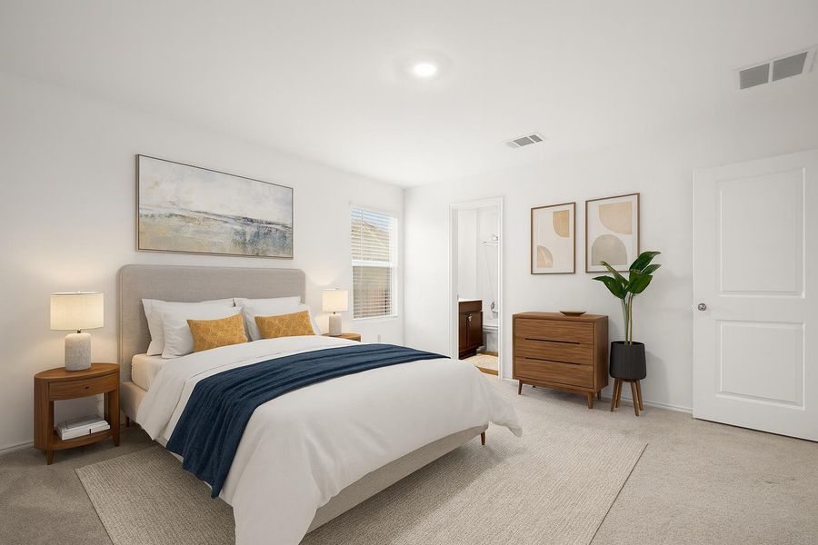 This home offers 3 bedrooms and 2 full bathrooms including this spacious primary suite. (Virtually staged photo)