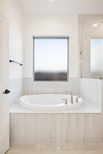 Bathroom with a relaxing tiled tub