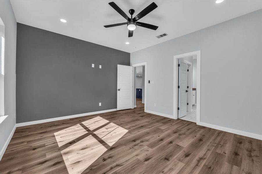 Unfurnished bedroom featuring recessed lighting, ceiling fan, and light wood-type flooring Unfurnished bedroom featuring recessed lighting, ceiling fan, and light wood-type flooring