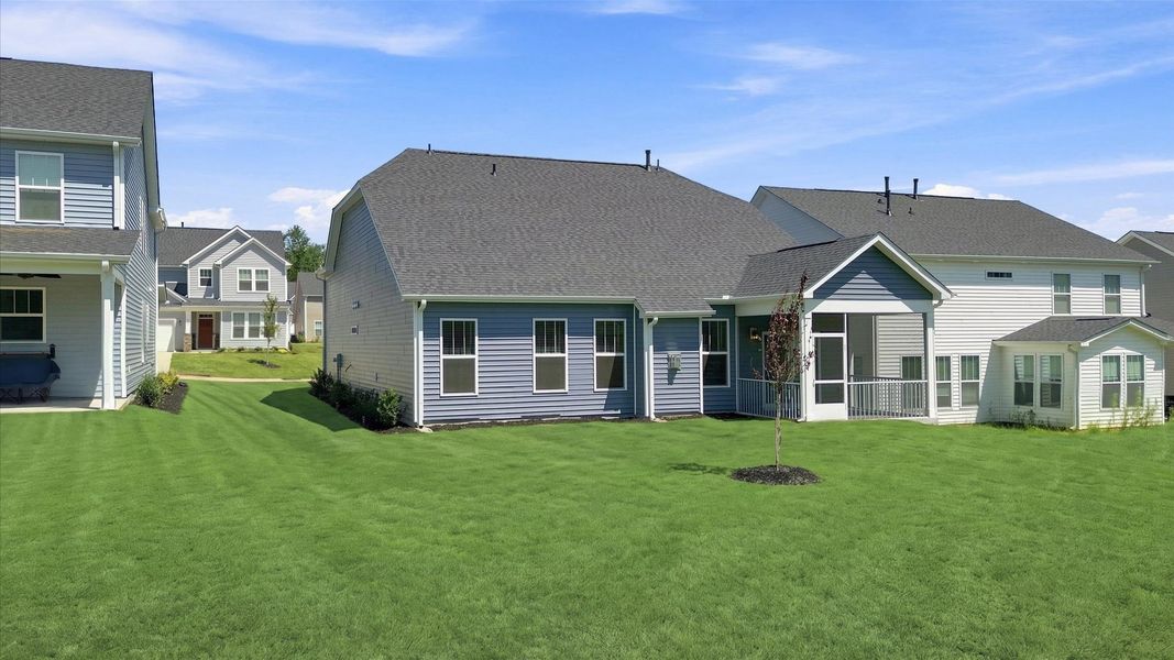 Elegant exterior with a rear screened-in porch—perfect for relaxing or entertaining outdoors