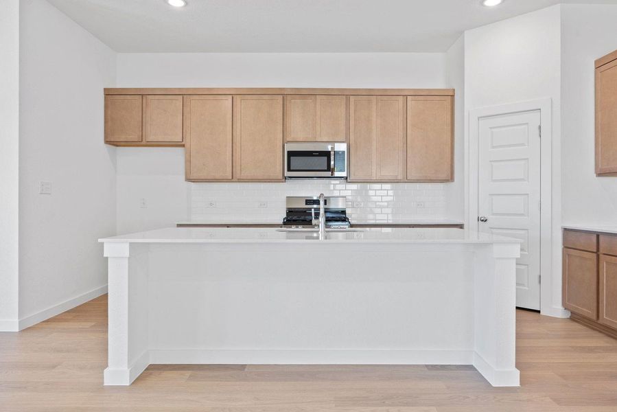 Kitchen in the Quartz home plan by Trophy Signature Homes – REPRESENTATIVE PHOTO Kitchen in the Quartz home plan by Trophy Signature Homes – REPRESENTATIVE PHOTO