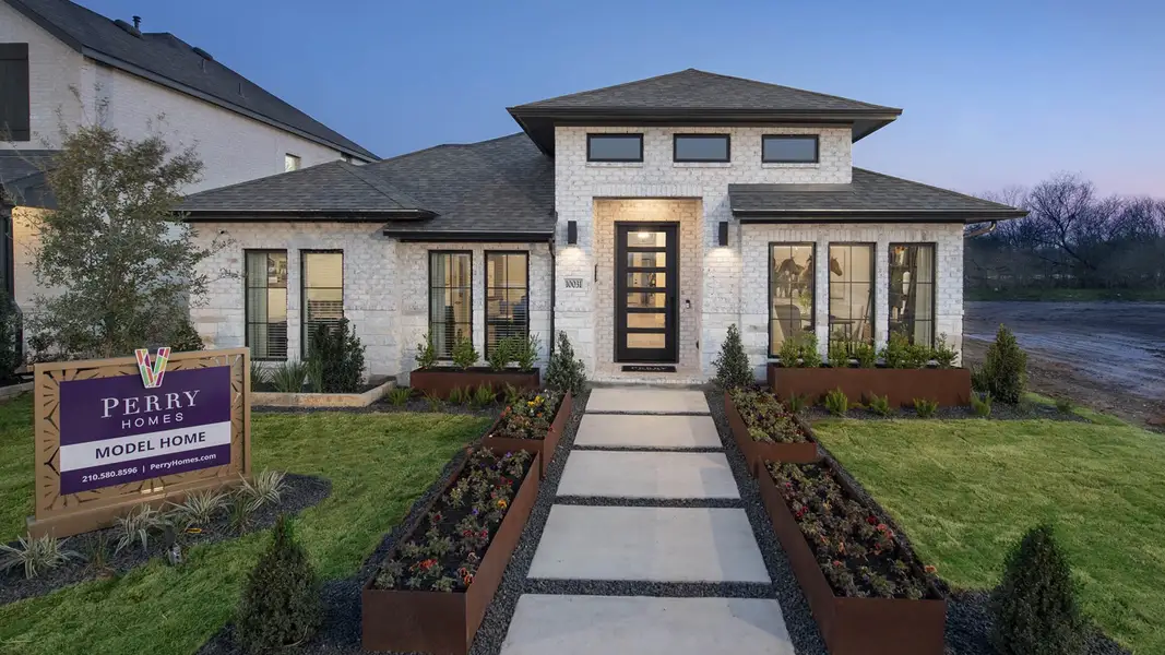 Front exterior of a new home in VIDA, San Antonio, TX, highlighting curb appeal (Image 1). Front exterior of a new home in VIDA, San Antonio, TX, highlighting curb appeal (Image 1).