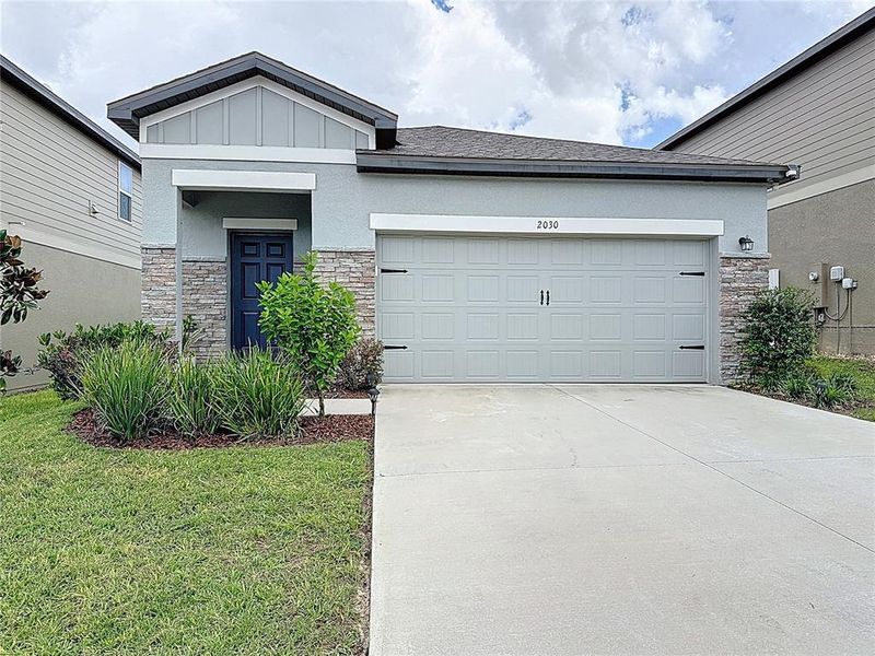 Front exterior of a new home in , Groveland, FL, highlighting curb appeal (Image 15).