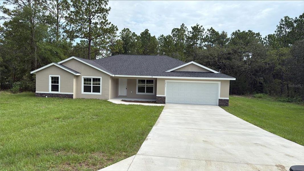 Front exterior of a new home in , Dunnellon, FL, highlighting curb appeal (Image 22).