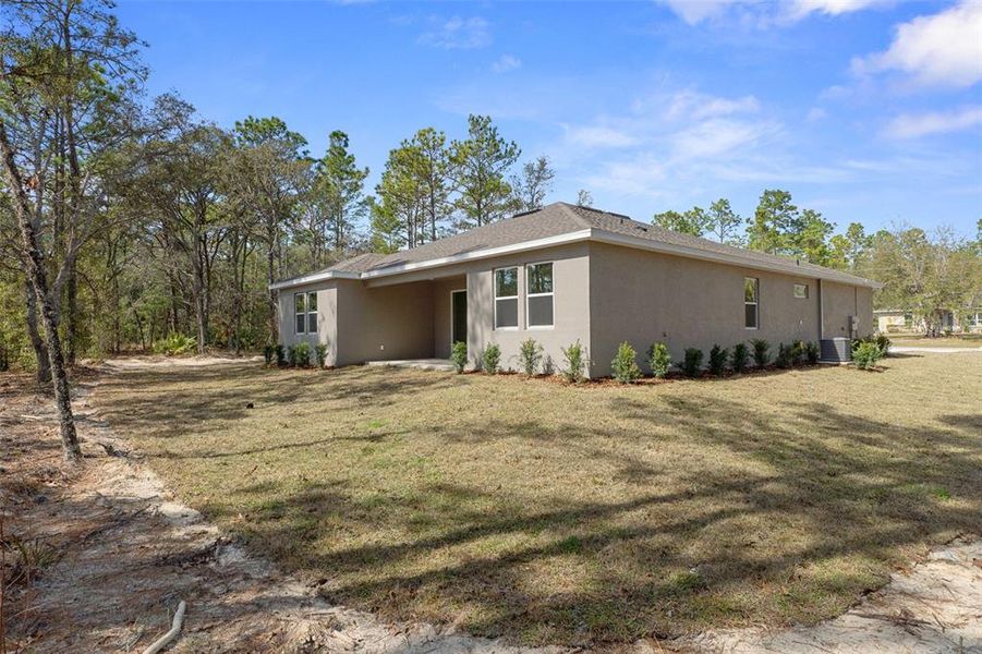 Exterior details and patio area of a home in Pine Ridge Estates, Beverly Hills (Image 23).