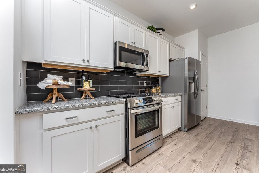 Furnished interior view inside a new home in Cobblestone Crossing Commons, Byron (Image 15).