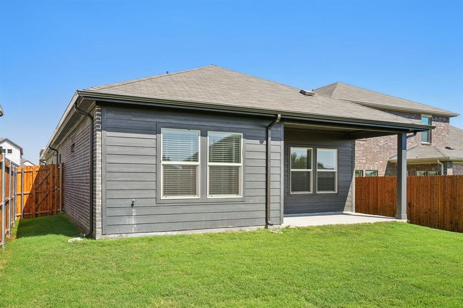 Exterior details and patio area of a home in Simpson Crossing - Spring Series, McKinney (Image 26). Exterior details and patio area of a home in Simpson Crossing - Spring Series, McKinney (Image 26).