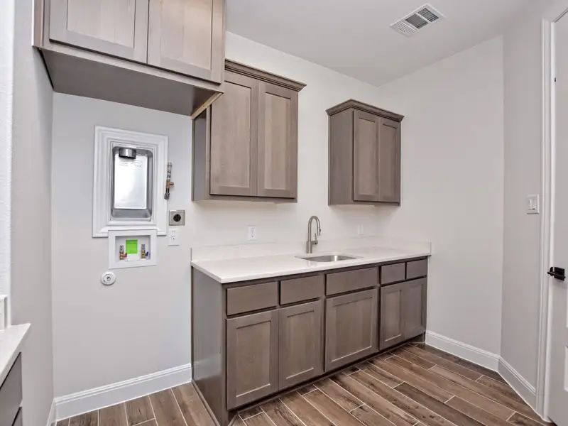 Representative furnished interior of a home built from the Santa Barbara II by Giddens Homes in Scofield Farms Estates, Georgetown (Image 75).
