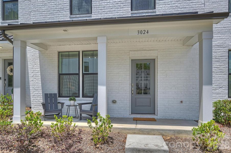 Exterior details and patio area of a home in The Townes of Cotswold, Charlotte (Image 3).