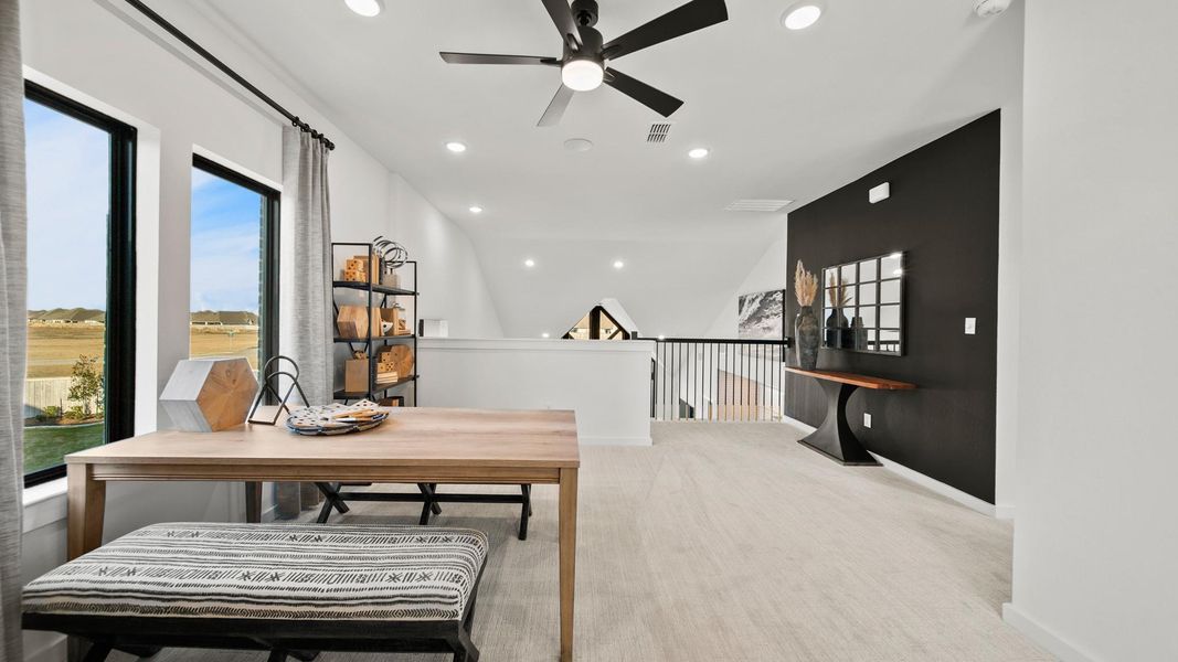 Spacious upstairs game room with ample lighting pouring through the windows and views to below. Spacious upstairs game room with ample lighting pouring through the windows and views to below.